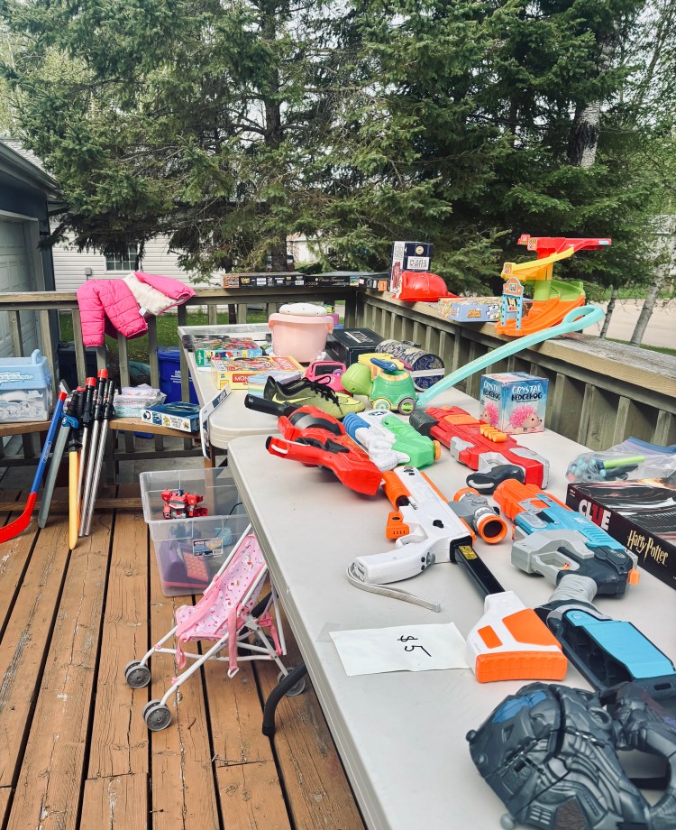 A bunch of items on a table at a garage sale